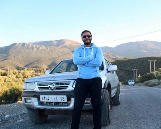Mehdi Hilalou with the crew car on a mountain road
